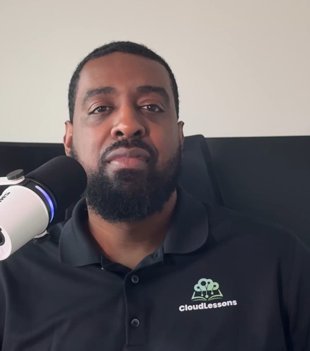 CloudLessons founder Tristan Johnson seated beside a microphone